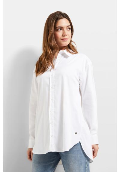 Блузка с длинными рукавами из эластичной хлопчатобумажной ткани.