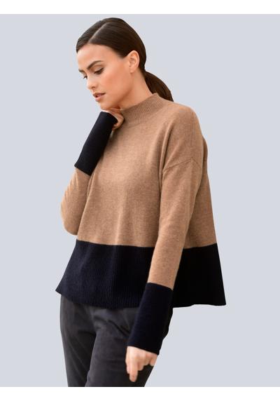 Вязаный пуловер в модной цветовой гамме.